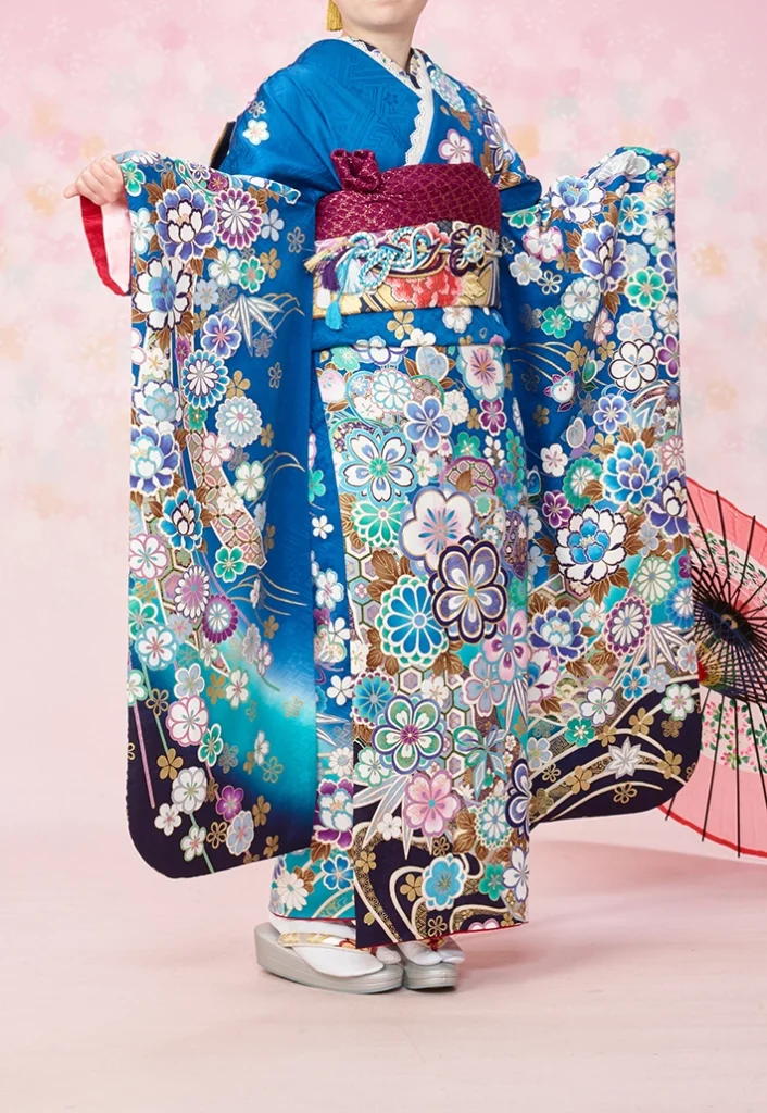 青地に四季の花をあしらったA-22青四季の花の振袖（正面全身）