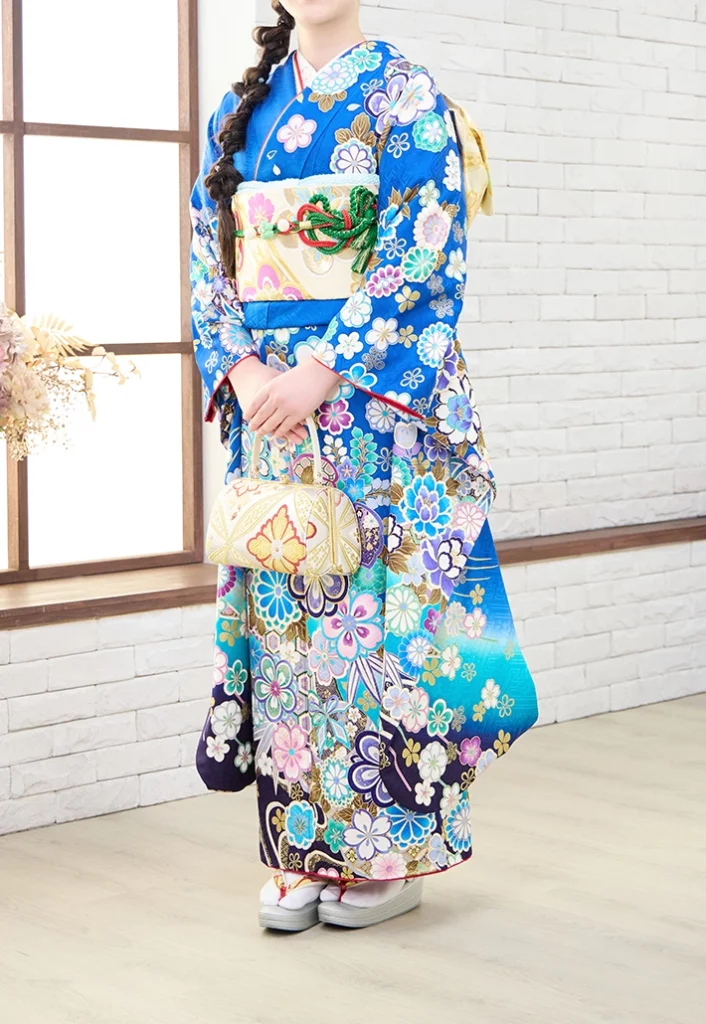 青地に四季の花をあしらったA-22青四季の花の振袖（正面全身）