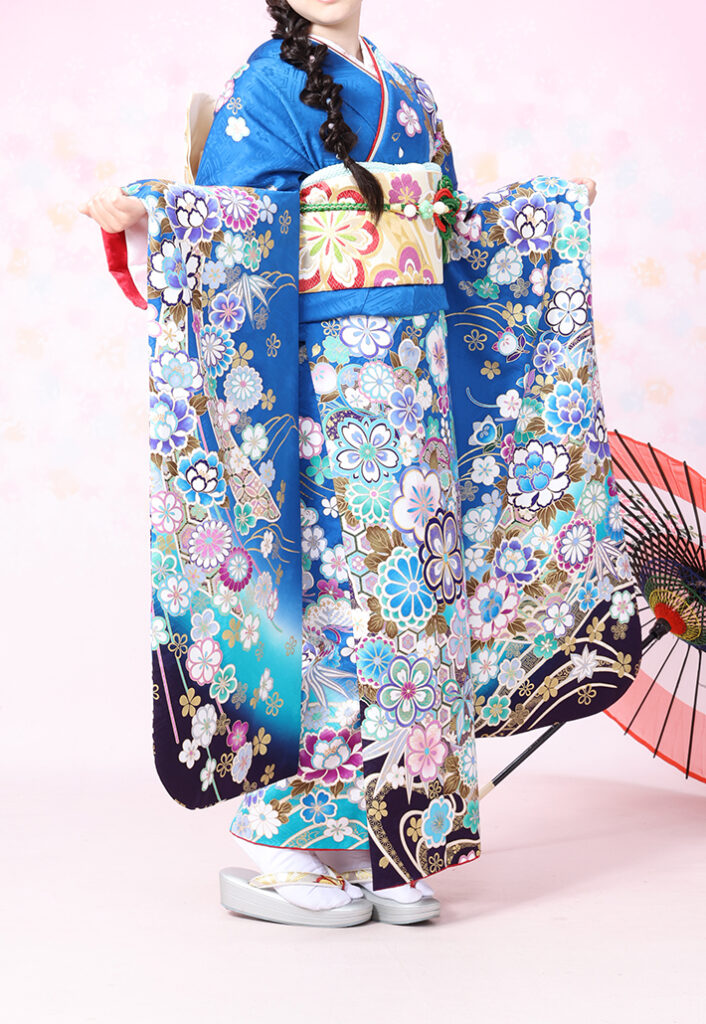 青地に四季の花をあしらったA-22青四季の花の振袖（正面全身）
